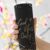 woman holding a good vibes only sublimated black skinny tumbler